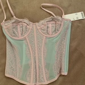 NWT urban outfitters out front under corset in sky color, size M